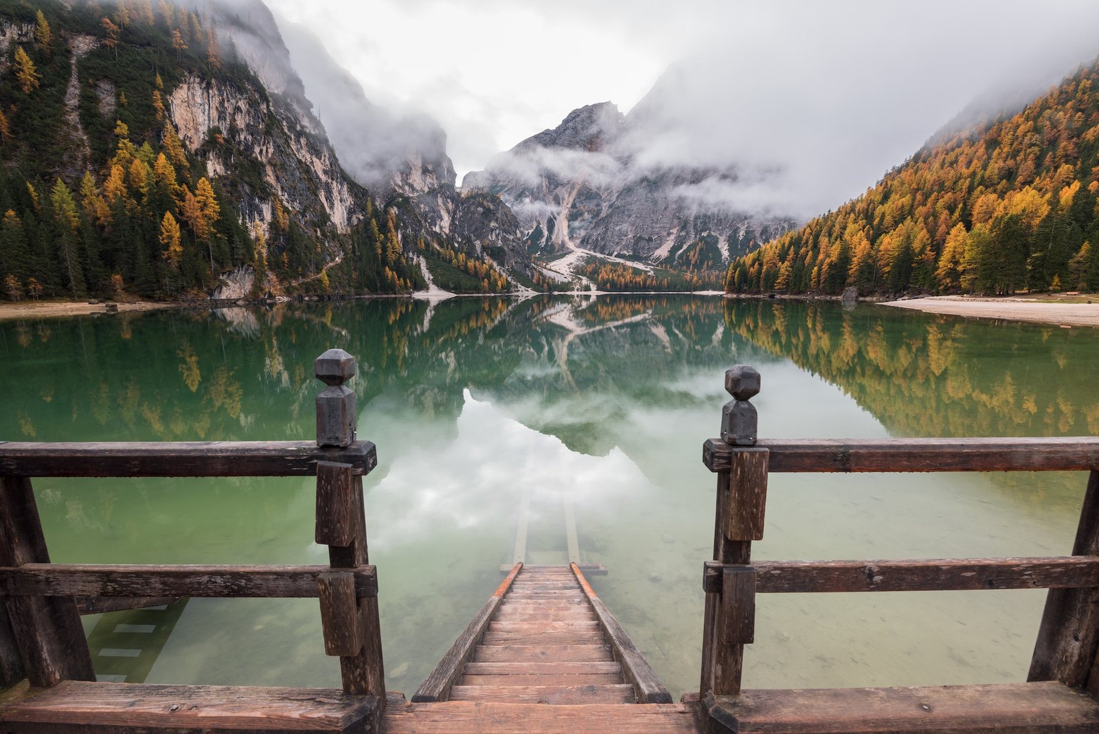 Moody autumn day in the Dolomites forest and mountains