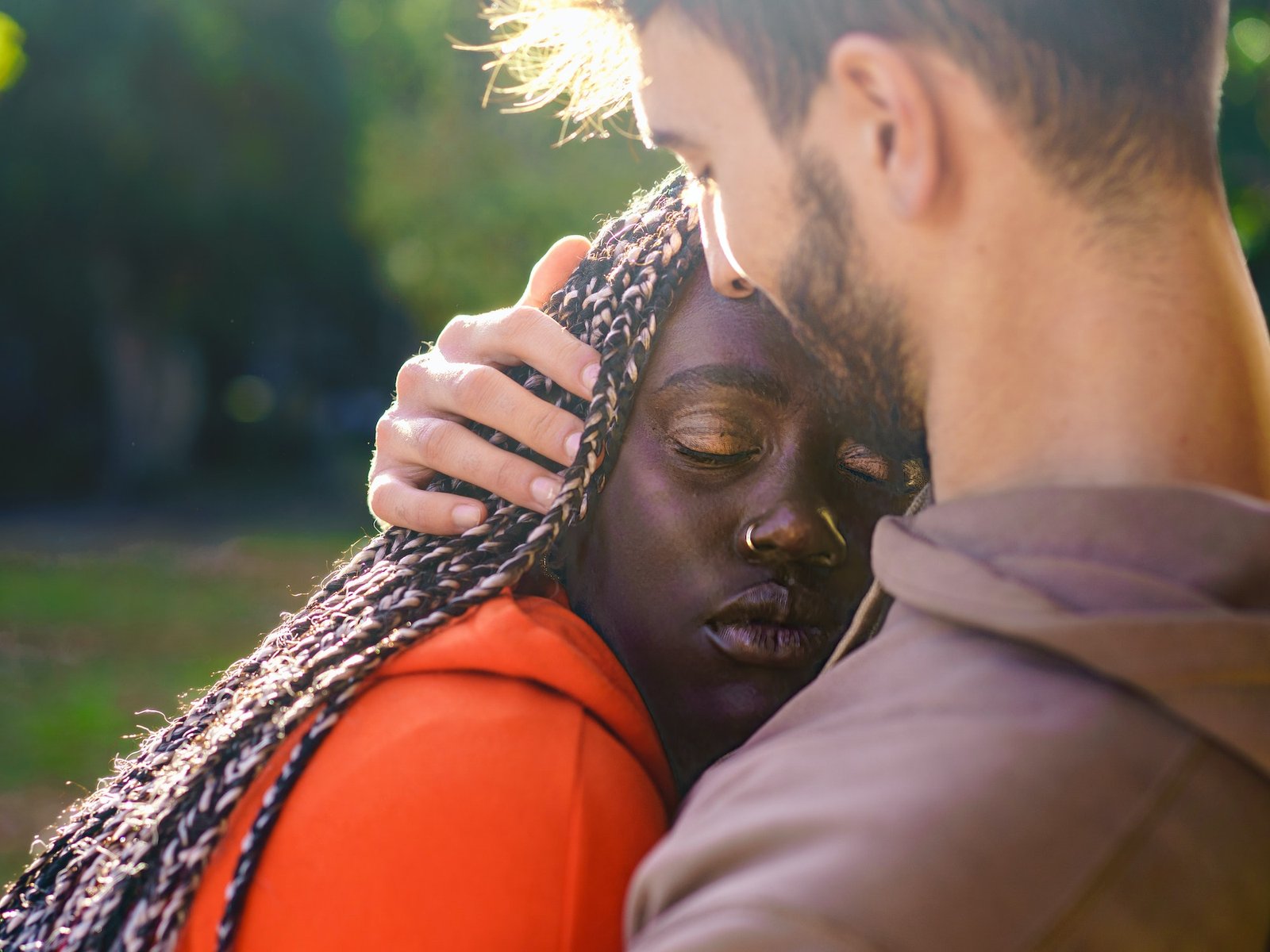 Multi-ethnic lovers hugging