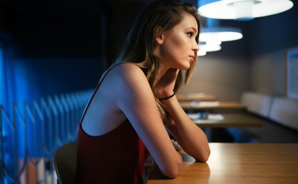 Portrait of clever young woman thinking alone