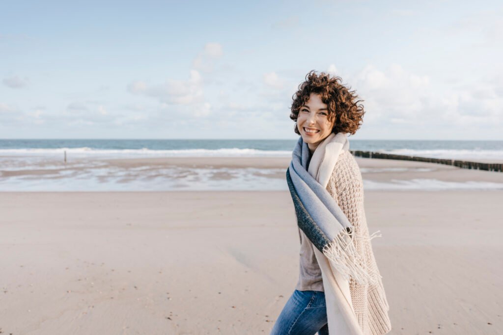 Portrait of happy woman on the beach